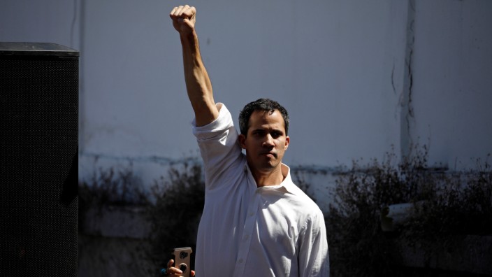 Juan Guaido, President of the Venezuelan National Assembly and lawmaker of the opposition party Popular Will (Voluntad Popular), gestures while he arrives a gathering in La Guaira