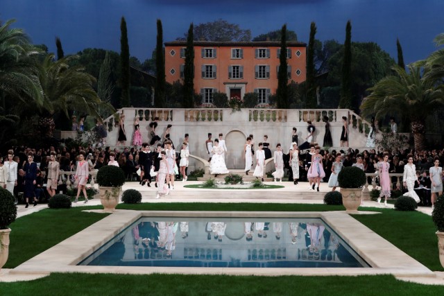 Models present creations by German designer Karl Lagerfeld as part of his Haute Couture Spring-Summer 2019 collection show for fashion house Chanel in Paris