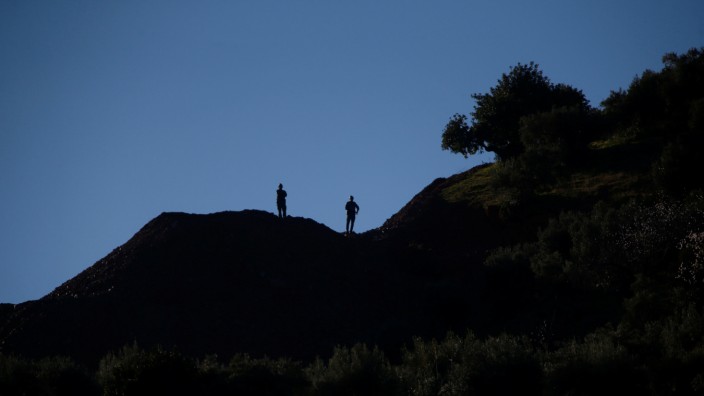 Spanish Civil Guards stand as they guard the area where Julen, a Spanish two-year-old boy, fell into a deep well twelve days ago when the family was taking a stroll through a private estate, in Totalan