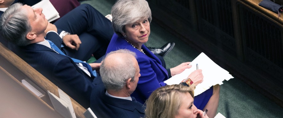 Britain's Prime Minister Theresa May looks up during PMQ session in Parliament, in London