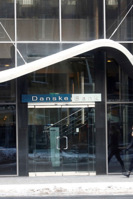 FILE PHOTO: A woman walks past Danske Bank's Estonian branch in Tallinn