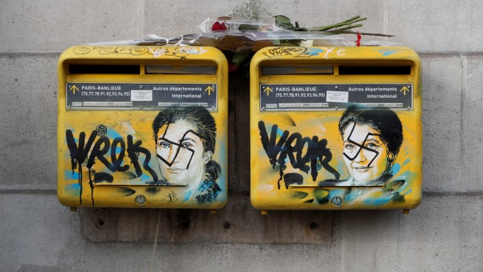 Vandalized mailboxes with swastikas covering portraits of the late Holocaust survivor and renowned French politician Simone Veil are seen before renovation in Paris