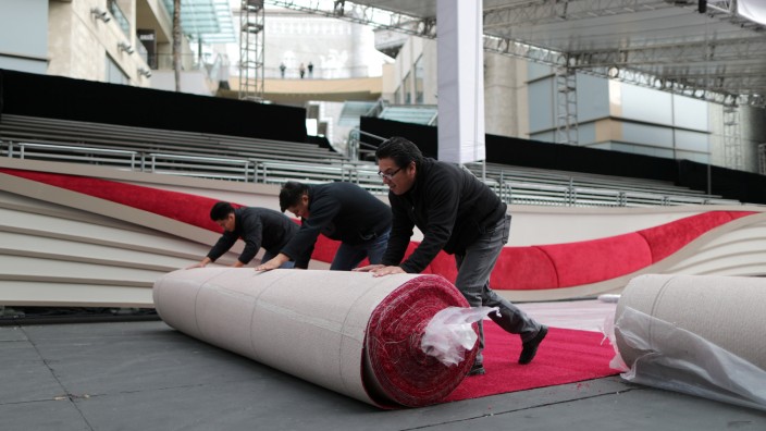 Workers roll out the Oscars red carpet as preparations continue for the 91st Academy Awards in Hollywood, Los Angeles