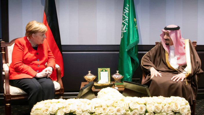 German Chancellor Angela Merkel meets Saudi Arabia's King Salman during the first EU-Arab League Summit in Sharm El Sheikh
