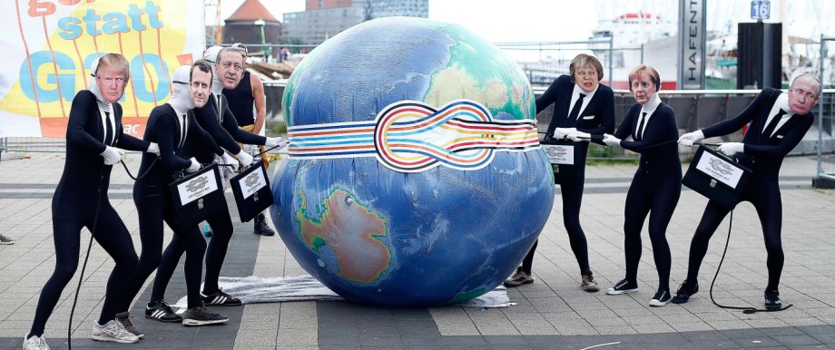 Activists from ATTAC organisation take part in a demonstration in front of Elbphilharmonie against the upcoming G20 summit in Hamburg