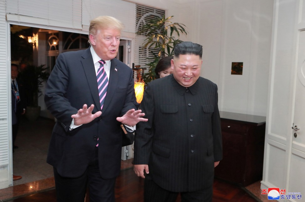 North Korea's leader Kim Jong Un and U.S. President Donald Trump speak during the second U.S.-North Korea summit in Hanoi