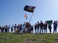 Border wall protesters shout during a protest march at the National Butterfly Center wildlife preserve near the Rio Grande River in Mission