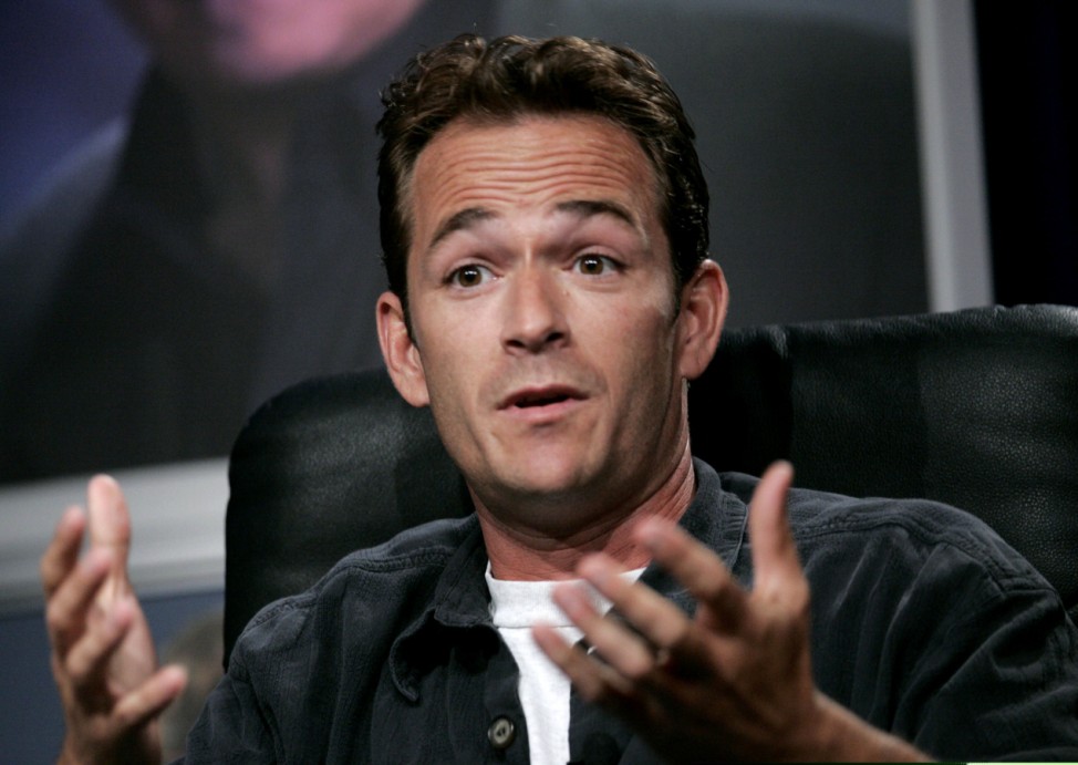 FILE PHOTO:  Actor Luke Perry reacts at the panel for Hallmark channel's 'Supernova' show during the Television C..