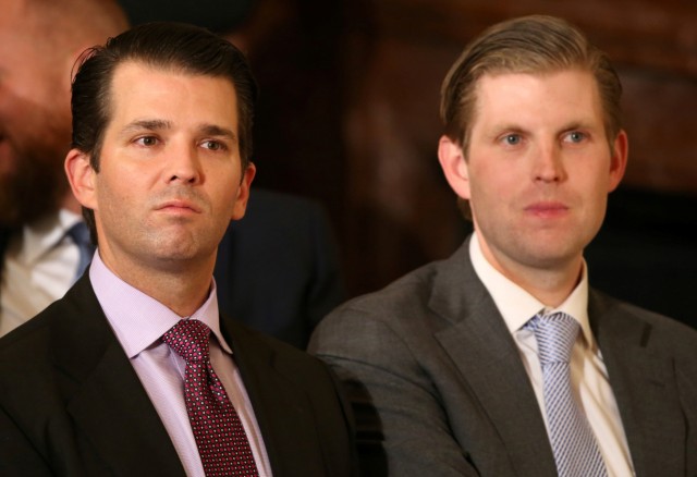 FILE PHOTO: U.S. President Donald Trump's sons Donald Trump Jr and Eric Trump sit in the audience waiting to watch their father announce his nominee for the  empty associate justice seat at the U.S. Supreme Court, at the White House in Washington