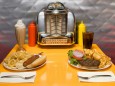 1950 s style diner table with juke box malt cola hot dog and hamburger ISTOCK THE SONG TITLES A