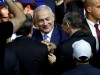 Israeli Prime Minister Benjamin Netanyahu is greeted by supporters of his Likud party as he arrives to speak following the announcement of exit polls in Israel's parliamentary election at the party headquarters in Tel Aviv, Israel
