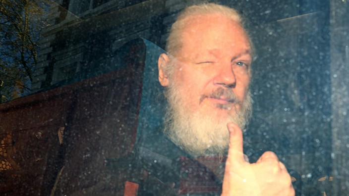 Julian Assange arrives at the Westminster Magistrates Court, after he was arrested  in London