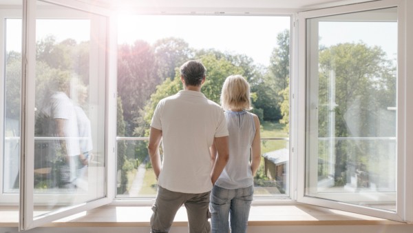 Mature couple looking out of window into the sun model released Symbolfoto property released PUBLICA