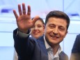 Candidate Zelenskiy waves to supporters following the announcement of an exit poll in Ukraine's presidential election in Kiev