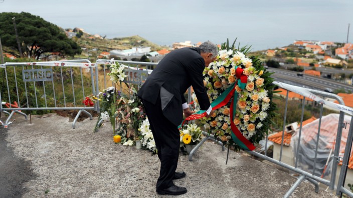 Portugal's President Marcelo Rebelo de Sousa visits the site of a bus accident in Canico