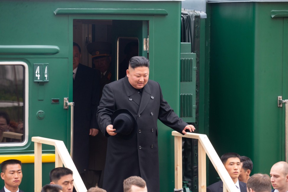 North Korean leader Kim Jong Un takes part in a welcoming ceremony at a railway station in Khasan