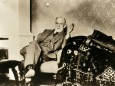 Sigmund Freud (1856-1939), Austrian neurologist and psychiatrist who founded the psychoanalytic school of psychology. In his summer residence near his analytic couch. Ca. 1930.