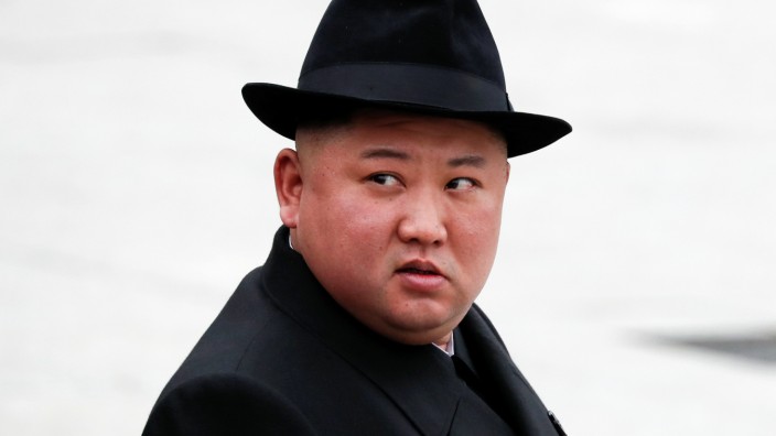 North Korean leader Kim Jong Un looks on after attending a wreath laying ceremony at a navy memorial in Vladivostok