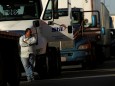 A man is seen outside his truck as he waits in a long queue for border customs control to cross into the U.S., at the Zaragoza-Ysleta border crossing bridge in Ciudad Juarez