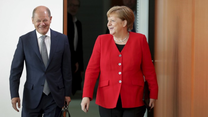 Koalitionsspitzen einigen sich auf Verbesserungen für Paketboten: Merkel und Scholz