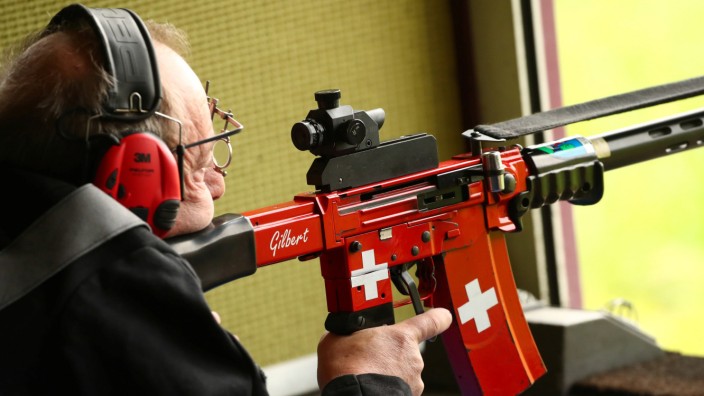 Swiss flags are pictured on the rifle of a participant to the Fribourg County 300m riffle final at the shooting range in Romont