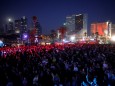 People gather at the fan zone near the beach at the eve of the 2019 Eurovision song contest final in Tel Aviv