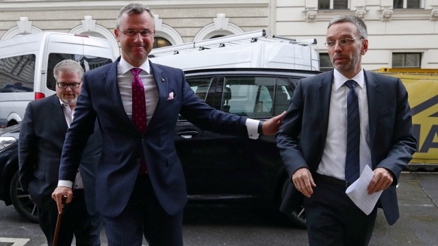 Designated new Chief of Freedom Party Norbert Hofer and Interior Minister Herbert Kickl arrive to address a news conference in Vienna