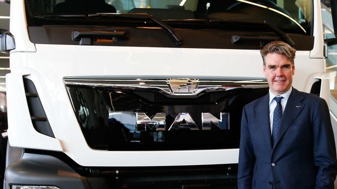 Drees CEO of German truck maker MAN SE, poses in front of a MAN truck in Munich