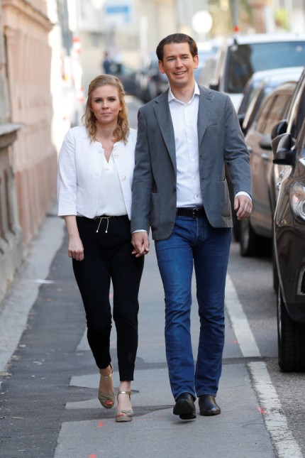 Austrian Chancellor Sebastian Kurz and his girlfriend Susanne Thier arrive to cast their votes during European Parliament Elections in Vienna