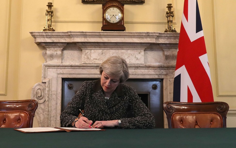 British PM May signs letter that will trigger Brexit