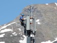 A technician installs 5G antennas of Swiss telecom operator Swisscom in Lenzerheide