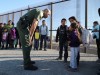 A group of Central American migrants is questioned about their children's health after surrendering to U.S. Border Patrol Agents south of the U.S.-Mexico border fence in El Paso