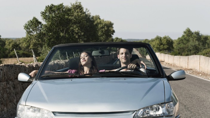 Spain Majorca Young couple travelling in cabriolet car model released PUBLICATIONxINxGERxSUIxAUTxH