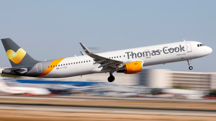 FILE PHOTO: A Thomas Cook Airbus A321 airplane takes off at the airport in Palma de Mallorca