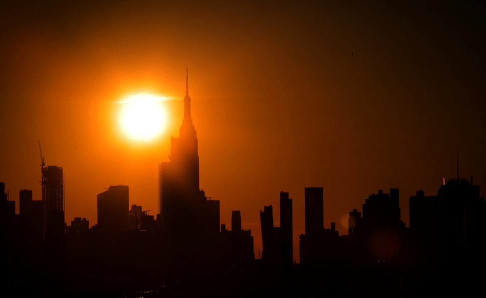 The sun sets on midtown Manhattan during a blackout in New York