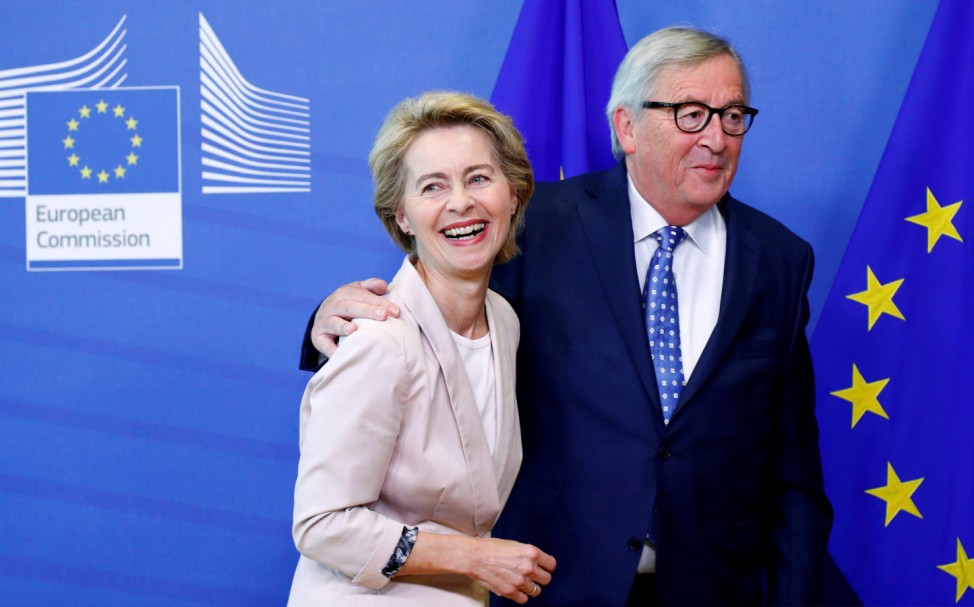 FILE PHOTO: German Defense Minister von der Leyen poses with EU Commission President Juncker in Brussels