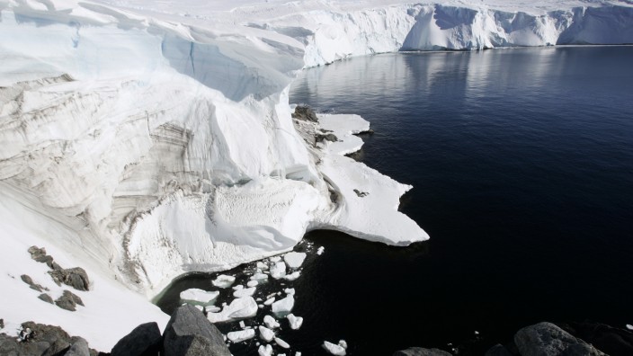 Melting ice shows through at a cliff face at Landsend, on the coast of Cape Denison in Antarctica