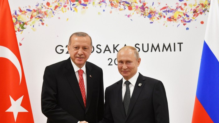 FILE PHOTO: Russian President Putin and Turkish President Erdogan attend their bilateral meeting on the sidelines of the G20 leaders summit in Osaka