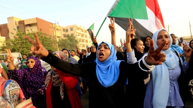 Sudanese protesters march during a demonstration to commemorate 40 days since the sit-in massacre in Khartoum North
