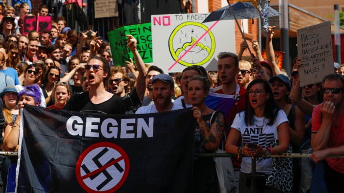 Counter-protesters are seen during a far-right identitarian movement demonstration in Halle