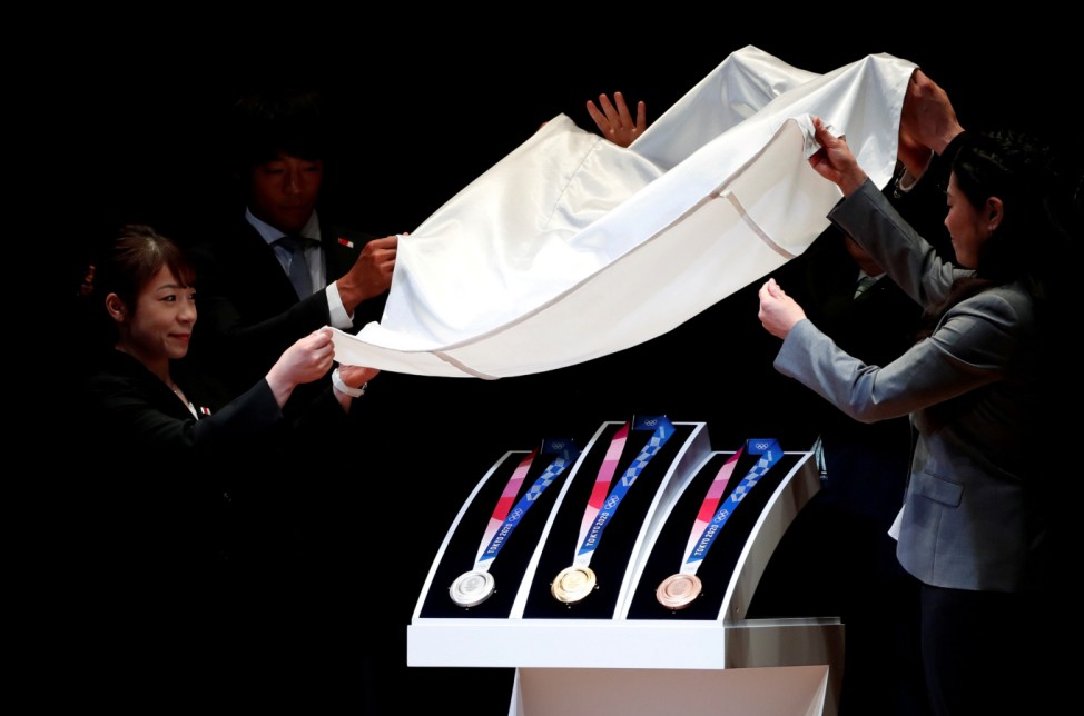 Design of the Tokyo 2020 Olympic medals are unveiled during the 'One Year to Go' ceremony celebrating one year out from the start of the summer games at Tokyo International Forum in Tokyo