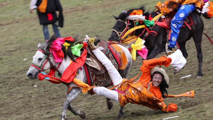 190731 LITANG July 31 2019 A rider performs horsemanship during a horse racing festival in