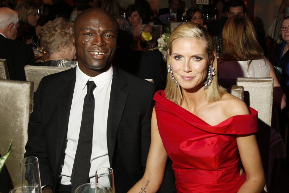 Singer Seal sits next to his wife Heidi Klum at Governors Ball following 81st Academy Awards in Hollywood