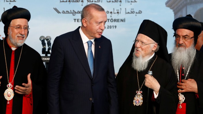 Turkish President Erdogan chats with Ecumenical Patriarch Bartholomew I during the groundbreaking ceremony of the Mor Efrem Syriac Orthodox Church in Istanbul