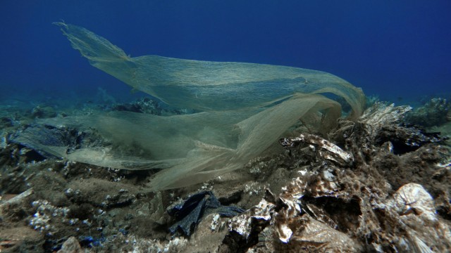 Plastic waste is pictured at the bottom of the sea, off the island of Andros