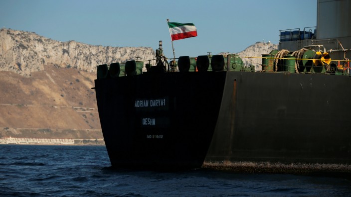 The Iranian flag flies at Iranian oil tanker Adrian Darya 1, before being named as Grace 1, as it sits anchored after the Supreme Court of the British territory lifted its detention order, in the Strait of Gibraltar