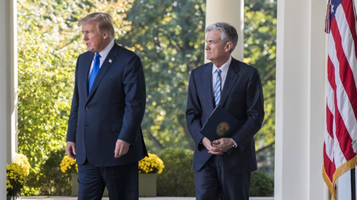 U S President Donald Trump and his Federal Reserve Chairman nominee Jerome Powell walk along the We