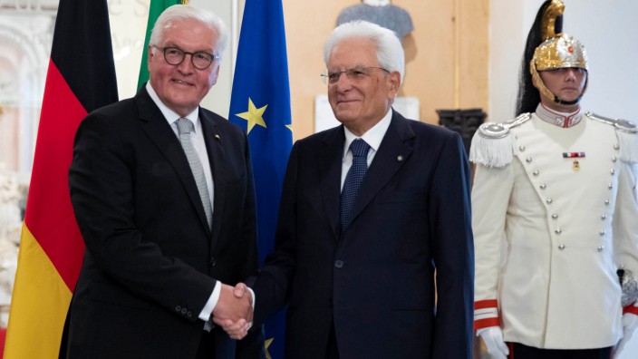 Italian President Sergio Mattarella and German President Frank-Walter Steinmeier shake hands during an event to commemorate the 75th anniversary of a massacre of Italian civilians carried out by the German Wehrmacht during World War II, in Fivizzano