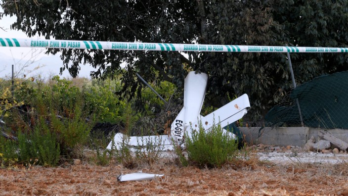 Debris and wreckage parts lay on the ground after a collision between an aircraft and a helicopter near the Village of Inca in the Spanish island of Mallorca