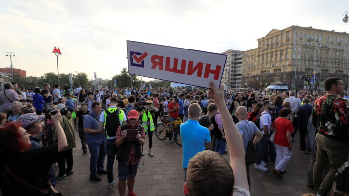 People attend a rally to demand free elections in Moscow